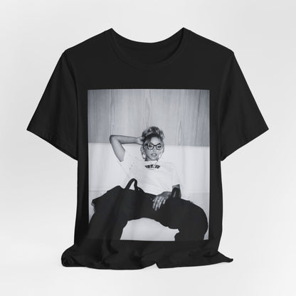 A black graphic t-shirt featuring a black and white portrait photo of Tinashe.