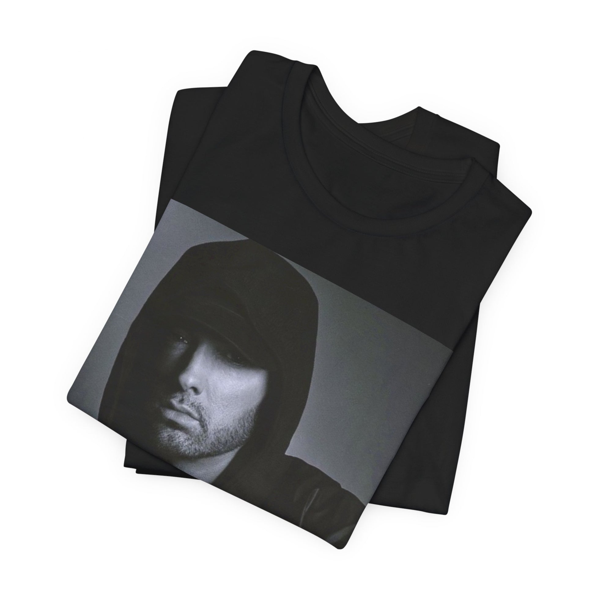 A black graphic t-shirt featuring a black and white, monochrome graphic or photo of Eminem.