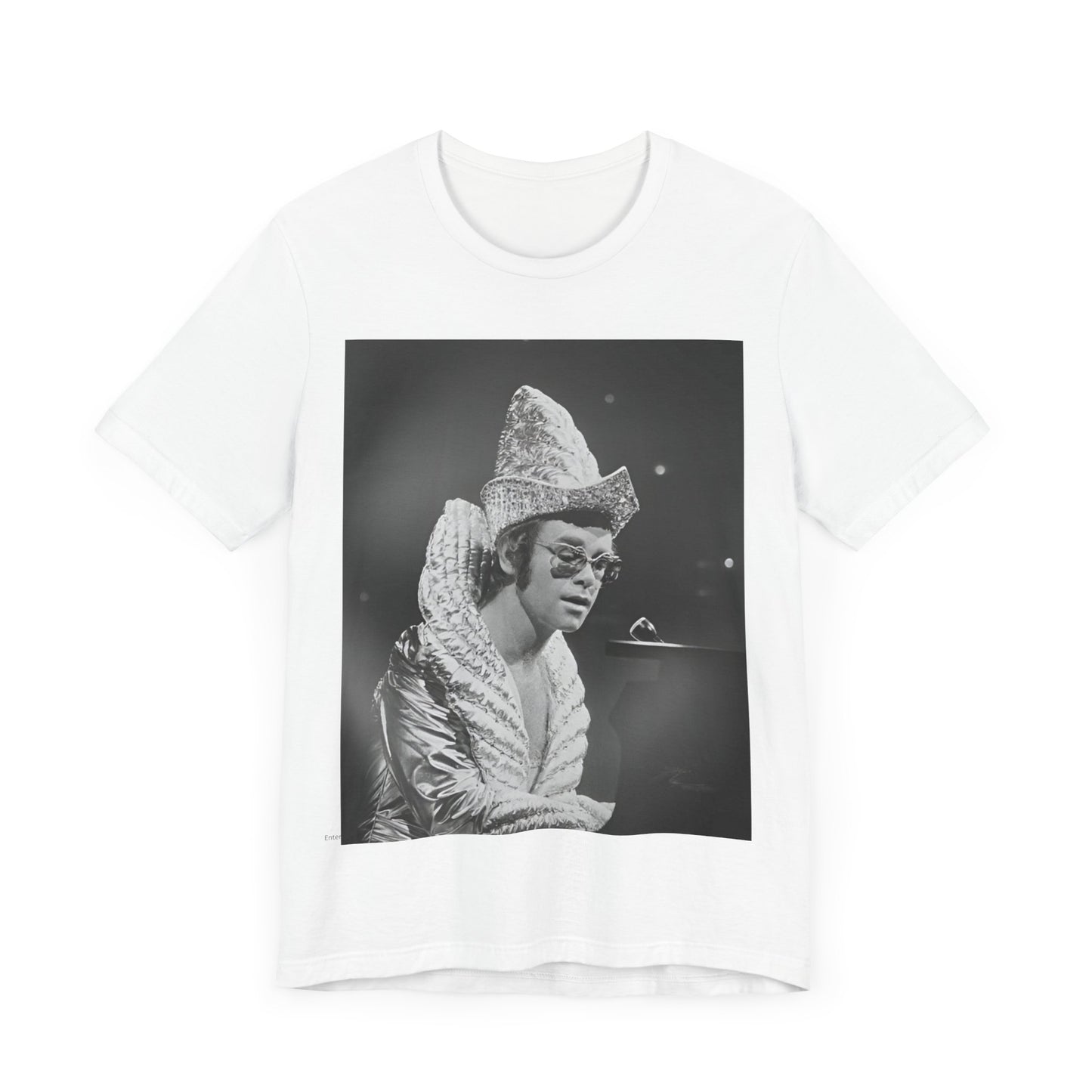 A black graphic t-shirt featuring a 70s pop aesthetic graphic of Elton John.