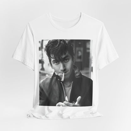 A black graphic t-shirt featuring a graphic of Alex Turner from Arctic Monkeys, in a rock star pose or setting.