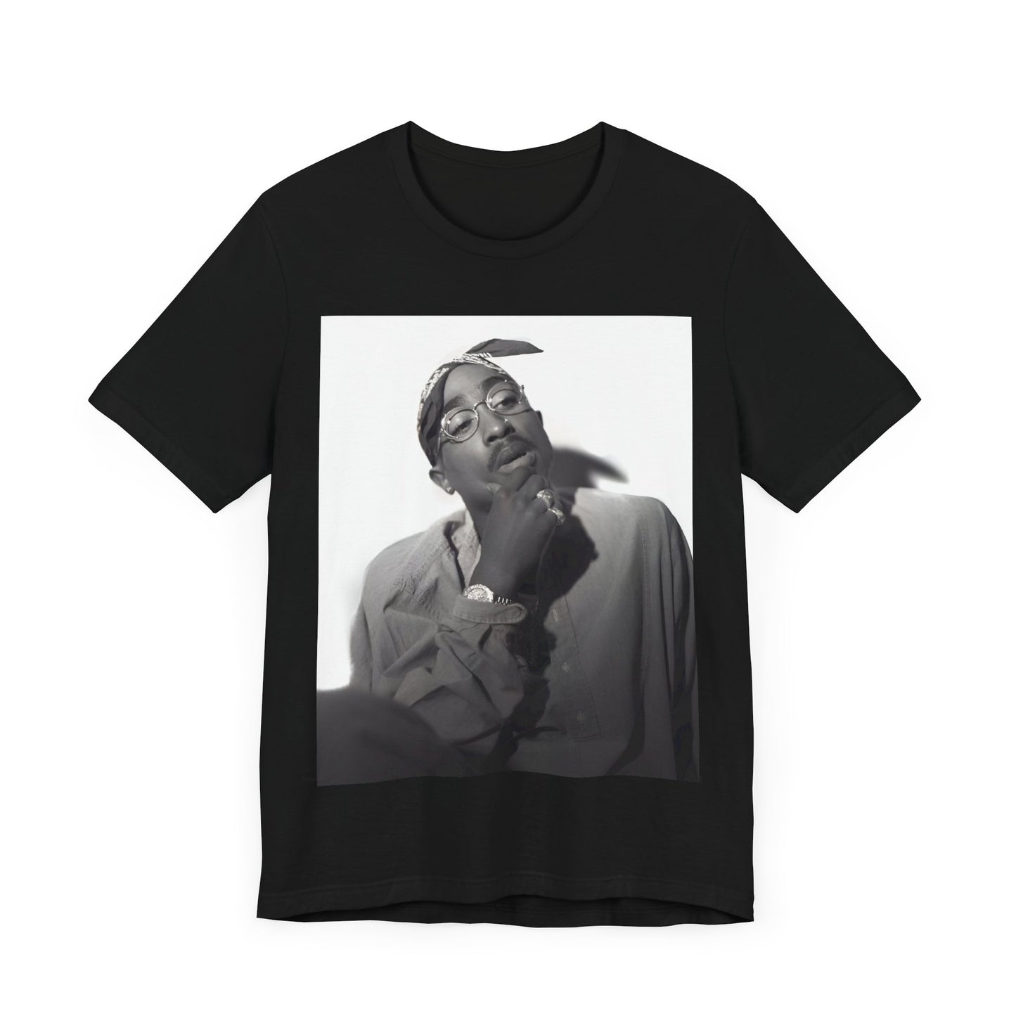 A black graphic t-shirt featuring a classic 90s West Coast rap graphic of Tupac.
