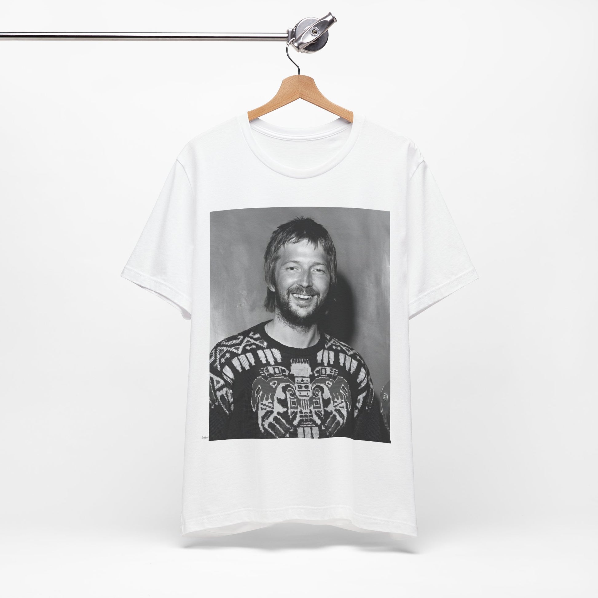 A black graphic t-shirt featuring a 70s photo portrait of Eric Clapton.