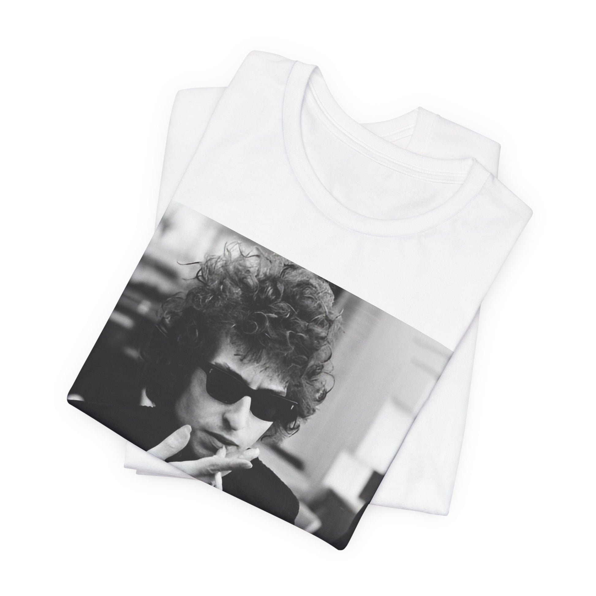 A black graphic t-shirt featuring a retro black and white graphic of Bob Dylan in a rebellious pose.