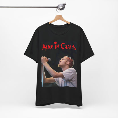 A black graphic t-shirt featuring the Alice In Chains logo in red, in a 90s grunge style.
