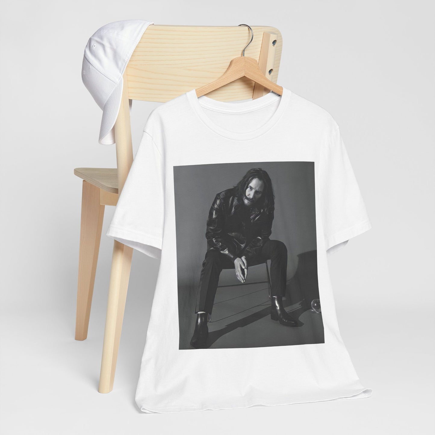 A black graphic t-shirt featuring a graphic of Keanu Reeves as John Wick.