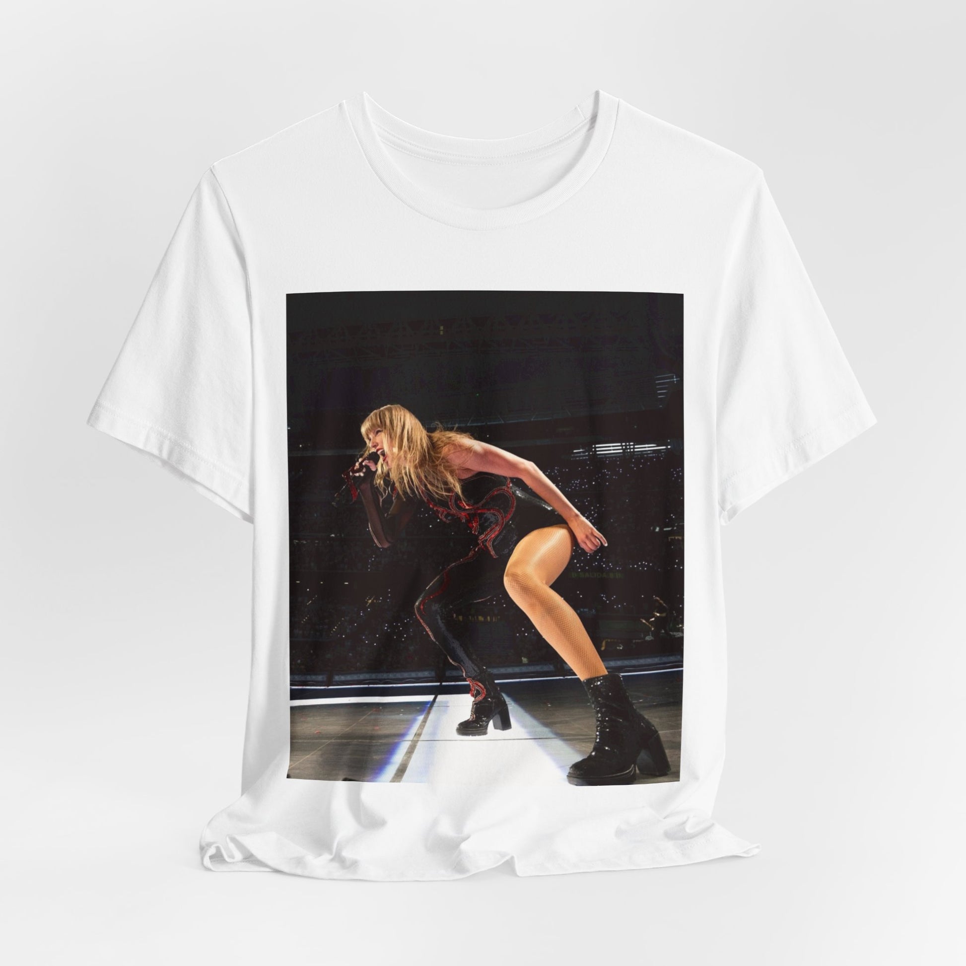 A black graphic t-shirt featuring a fierce graphic of Taylor Swift on stage.