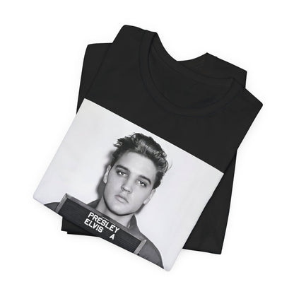 A black graphic t-shirt featuring a retro mugshot photo of Elvis Presley.