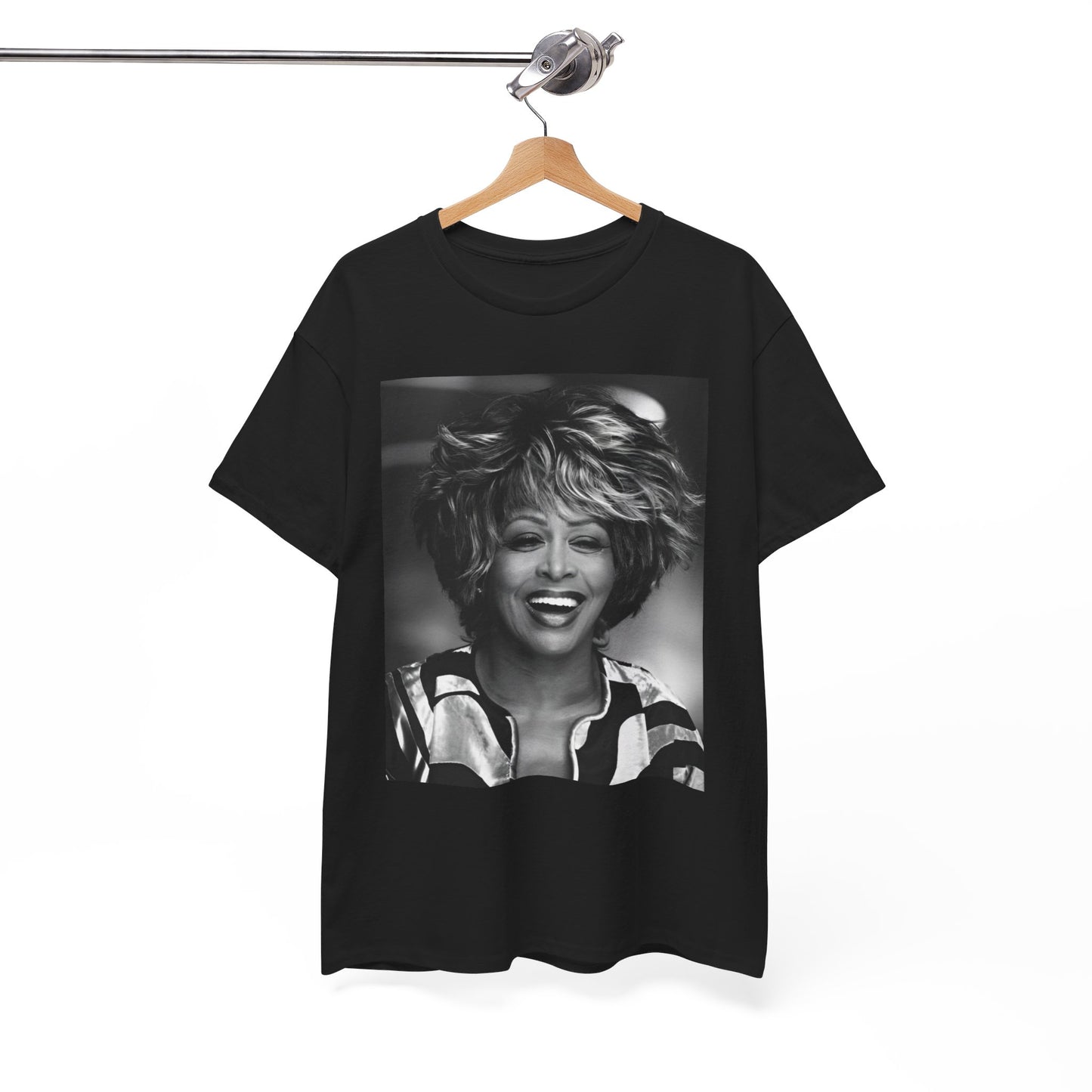 A black graphic t-shirt featuring a classic 80s pop aesthetic graphic of Tina Turner.