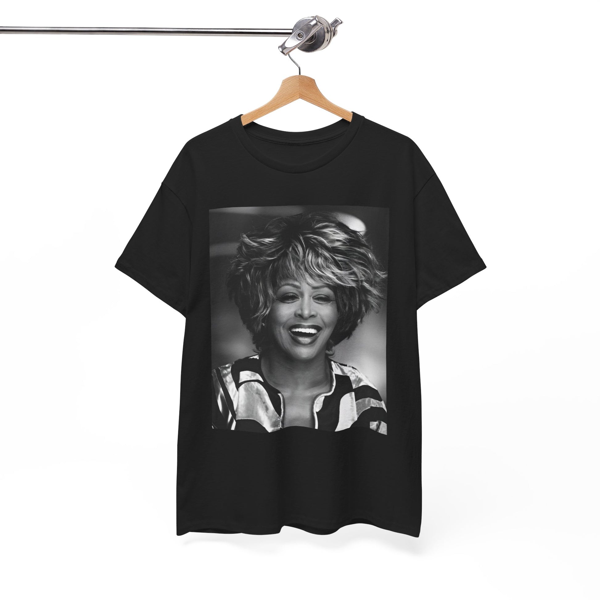 A black graphic t-shirt featuring a classic 80s pop aesthetic graphic of Tina Turner.