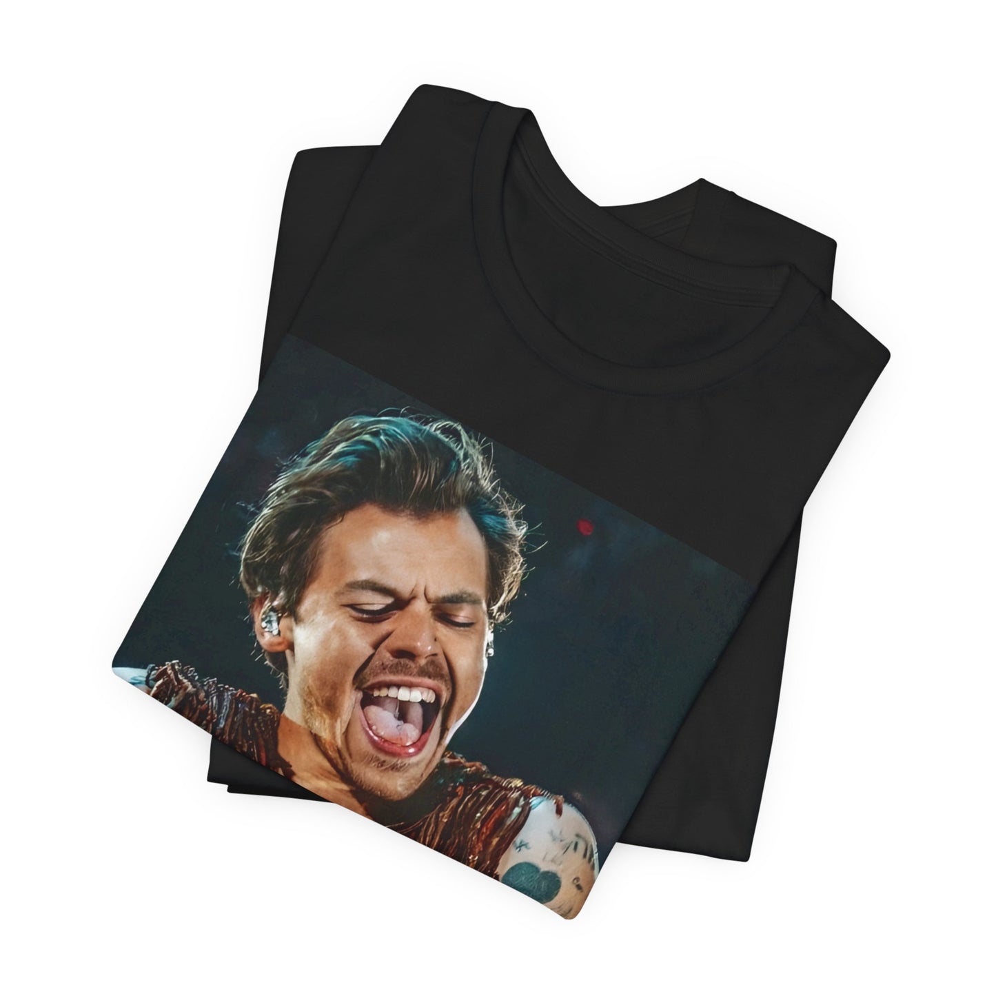 A black graphic t-shirt featuring a graphic or photo of Harry Styles performing live on stage.