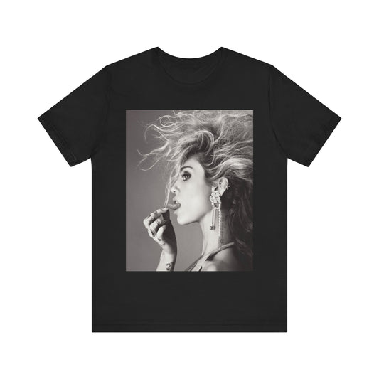 A black graphic t-shirt featuring a graphic of Miley Cyrus as a grunge rockstar.