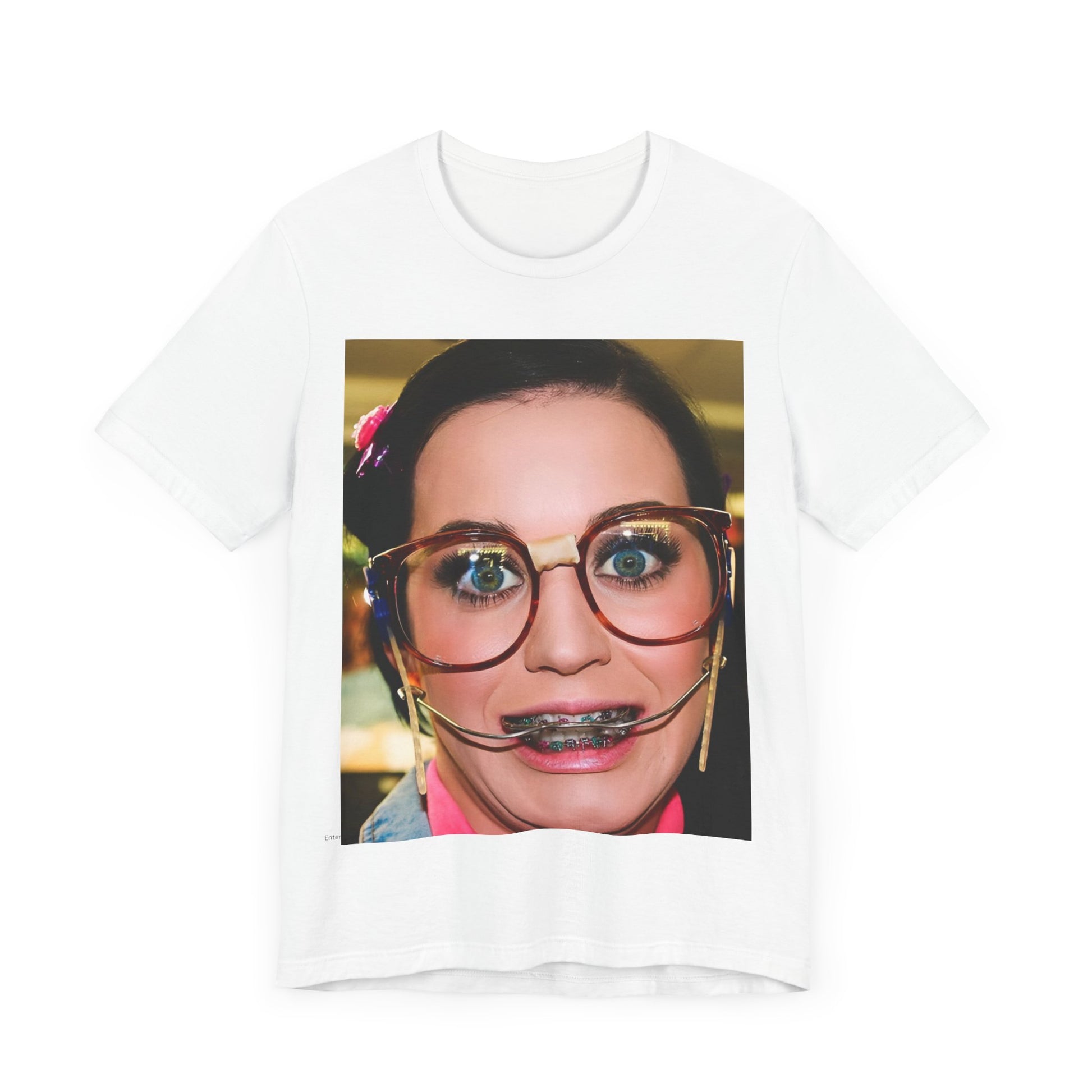 A black graphic t-shirt featuring a graphic related to Katy Perry's "I Kissed A Girl" song or era.