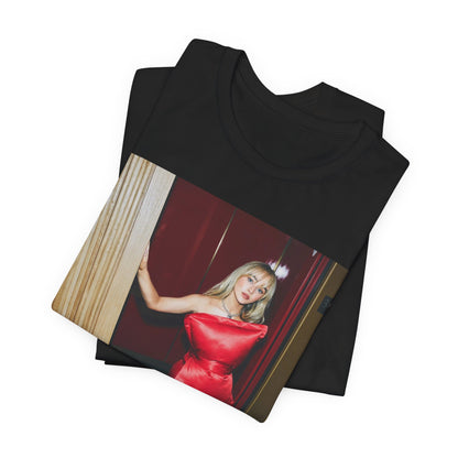 A black graphic t-shirt featuring a graphic of Sabrina Carpenter with 'hot pop vibes'.
