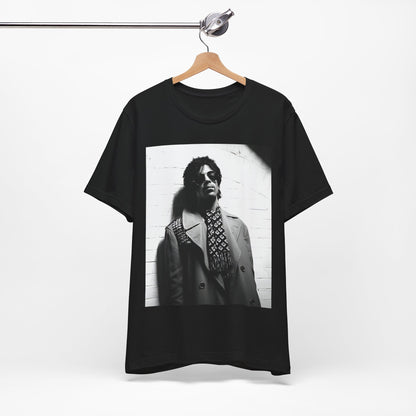 A black graphic t-shirt featuring Prince's iconic symbol, representing 'The Artist Formerly Known As'.