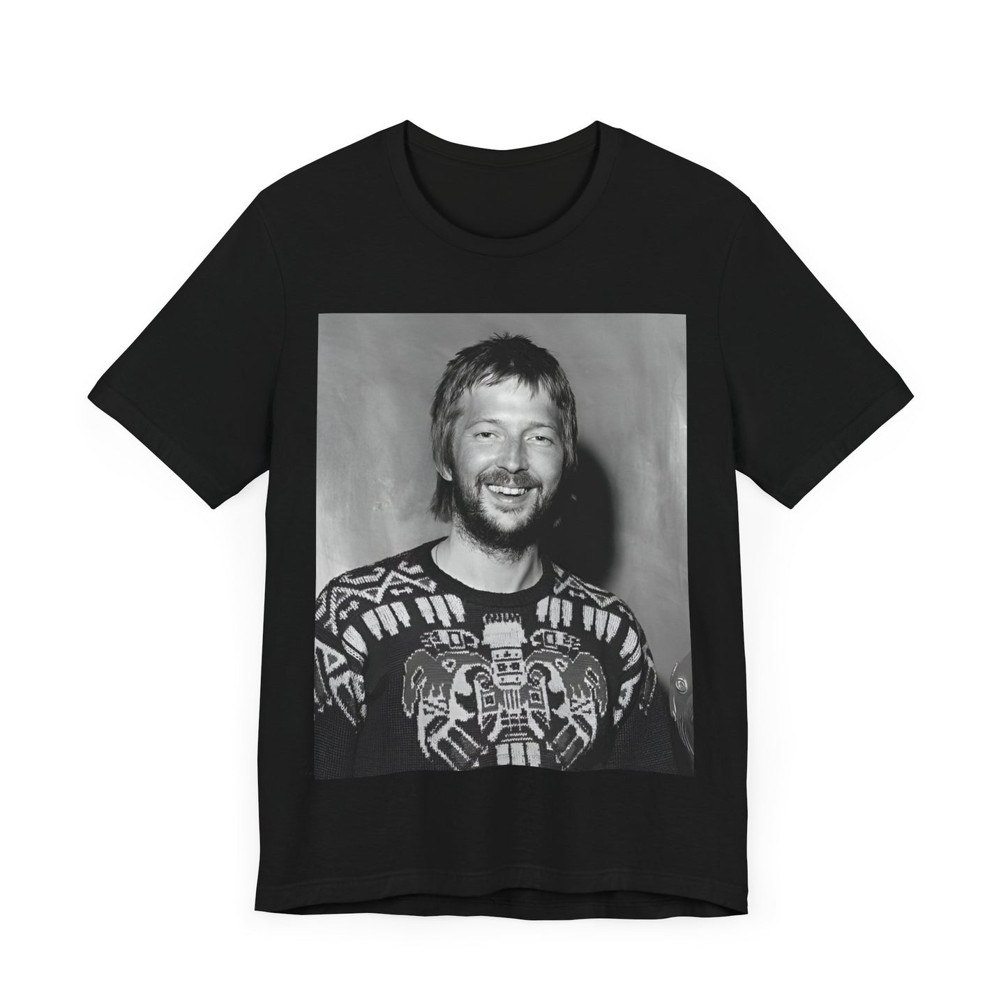 A black graphic t-shirt featuring a 70s photo portrait of Eric Clapton.