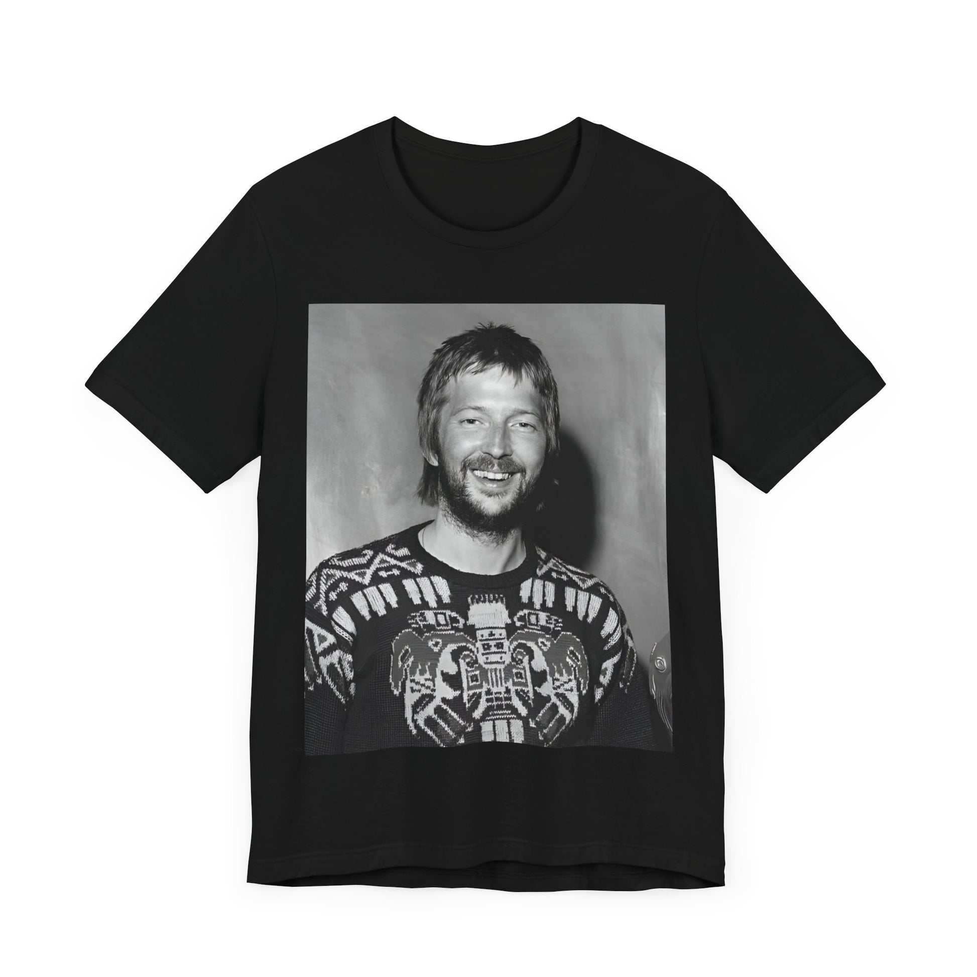 A black graphic t-shirt featuring a 70s photo portrait of Eric Clapton.