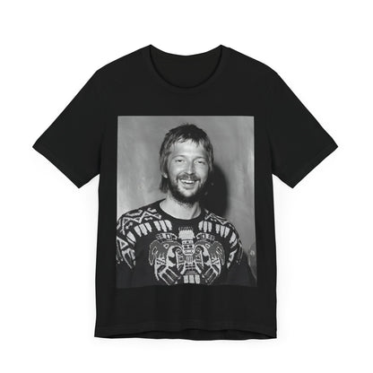 A black graphic t-shirt featuring a 70s photo portrait of Eric Clapton.