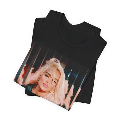 A black graphic t-shirt featuring a graphic of Karol G as an empowered Latina icon.