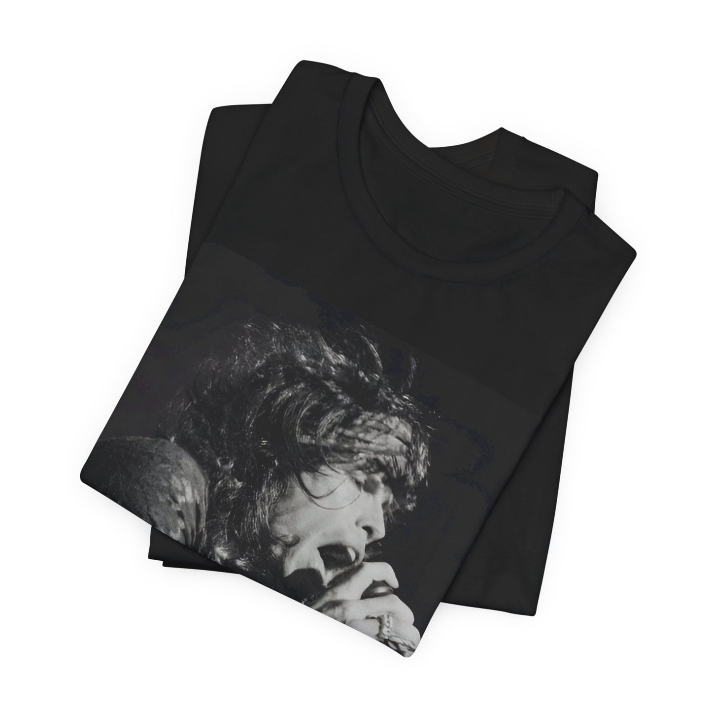 A black graphic t-shirt featuring a retro 70s-style illustration or photo of Aerosmith, designed to evoke their 'On Tour' presence, possibly with band members on stage or tour bus imagery.