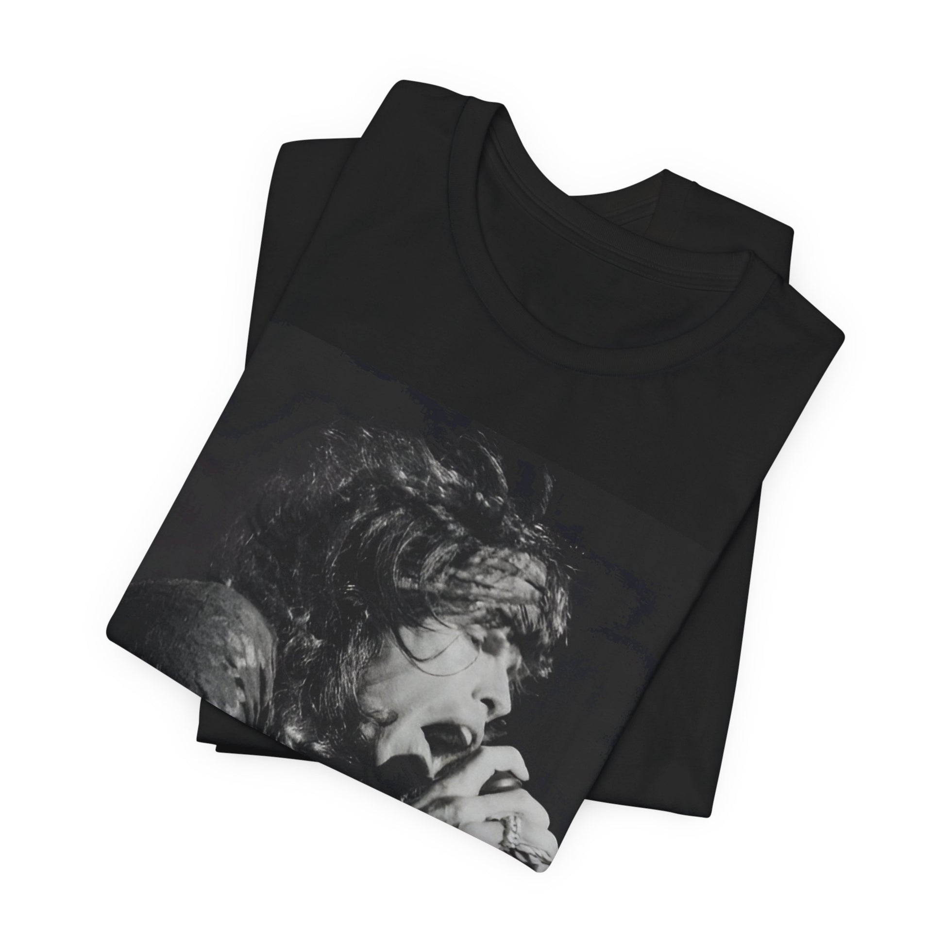 A black graphic t-shirt featuring a retro 70s-style illustration or photo of Aerosmith, designed to evoke their 'On Tour' presence, possibly with band members on stage or tour bus imagery.