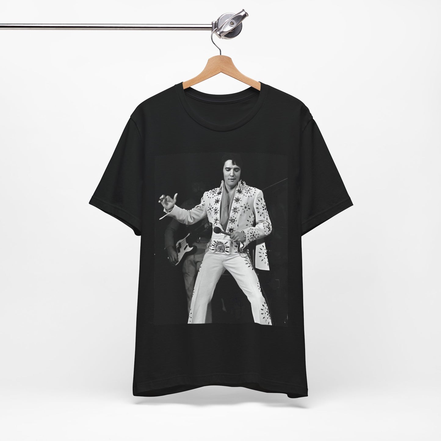 A black graphic t-shirt featuring a stylized graphic of Elvis Presley as The King of Rock 'n' Roll.