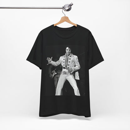A black graphic t-shirt featuring a stylized graphic of Elvis Presley as The King of Rock 'n' Roll.