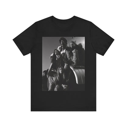 A black graphic t-shirt featuring a 90s black and white photographic portrait of the band Alice In Chains, capturing their iconic grunge look.