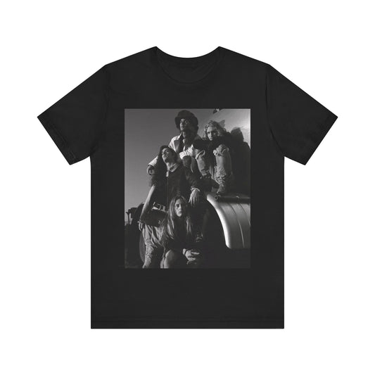 A black graphic t-shirt featuring a 90s black and white photographic portrait of the band Alice In Chains, capturing their iconic grunge look.