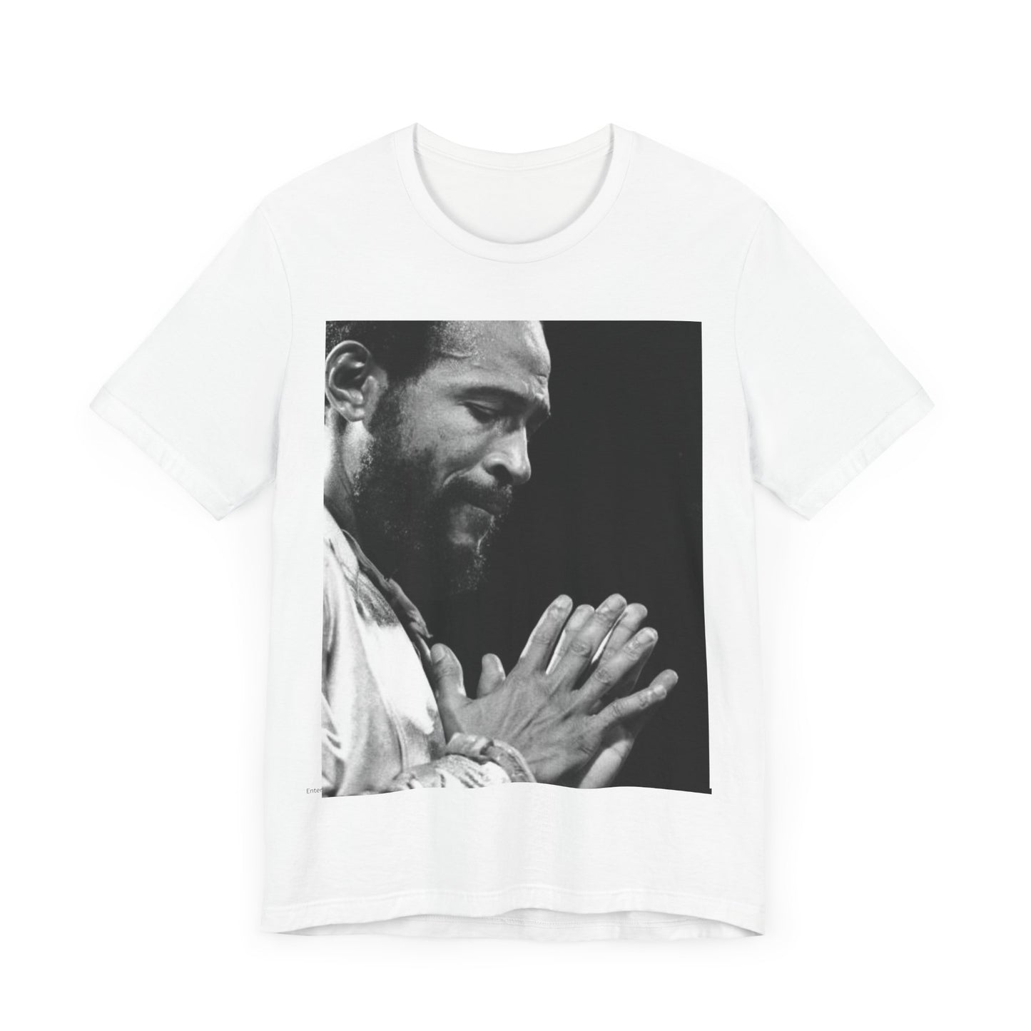 A black graphic t-shirt featuring a 70s graphic of Marvin Gaye emphasizing his soulful voice.