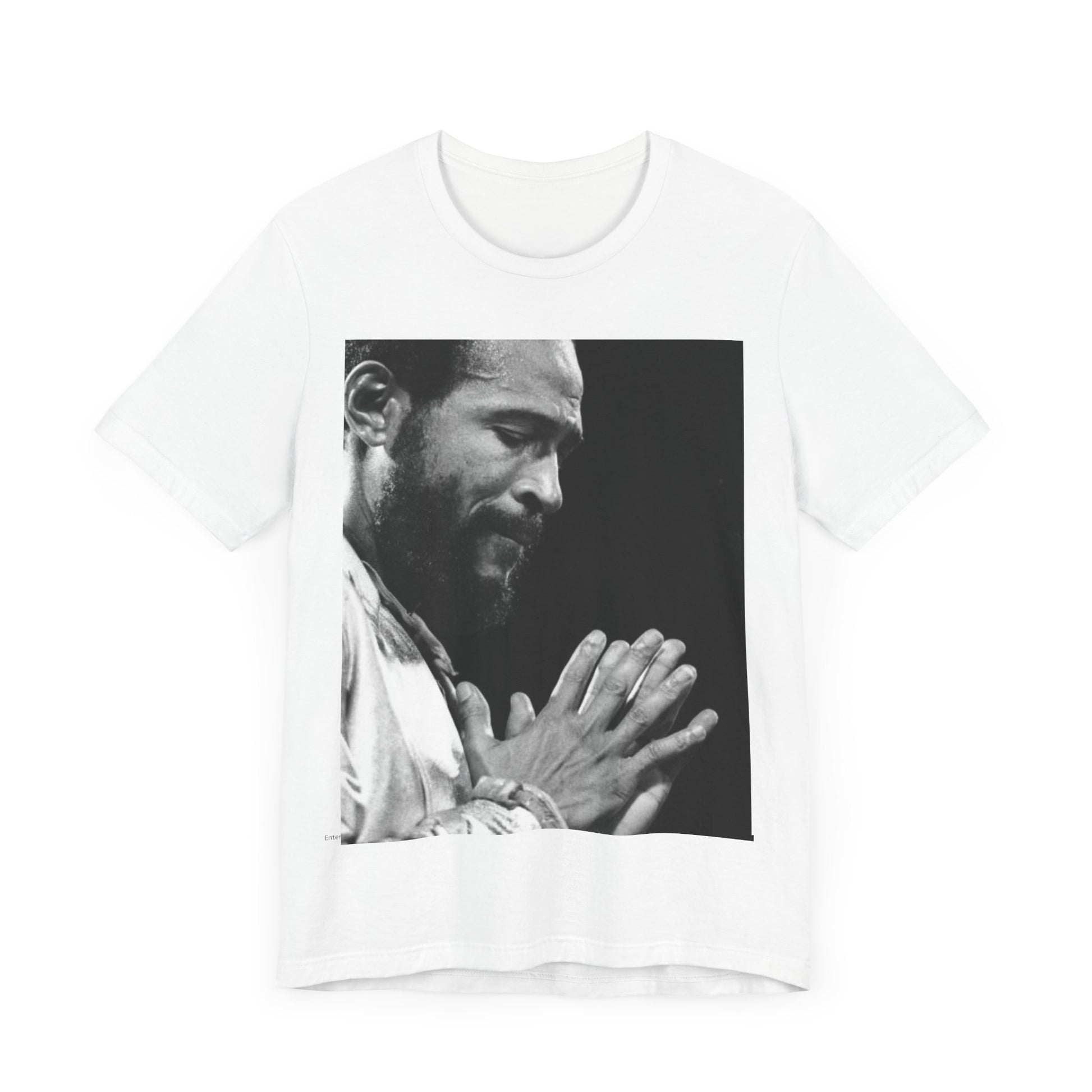 A black graphic t-shirt featuring a 70s graphic of Marvin Gaye emphasizing his soulful voice.