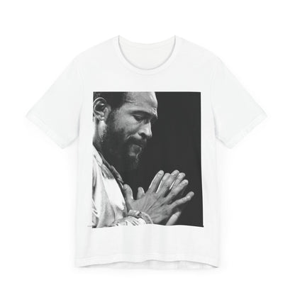 A black graphic t-shirt featuring a 70s graphic of Marvin Gaye emphasizing his soulful voice.