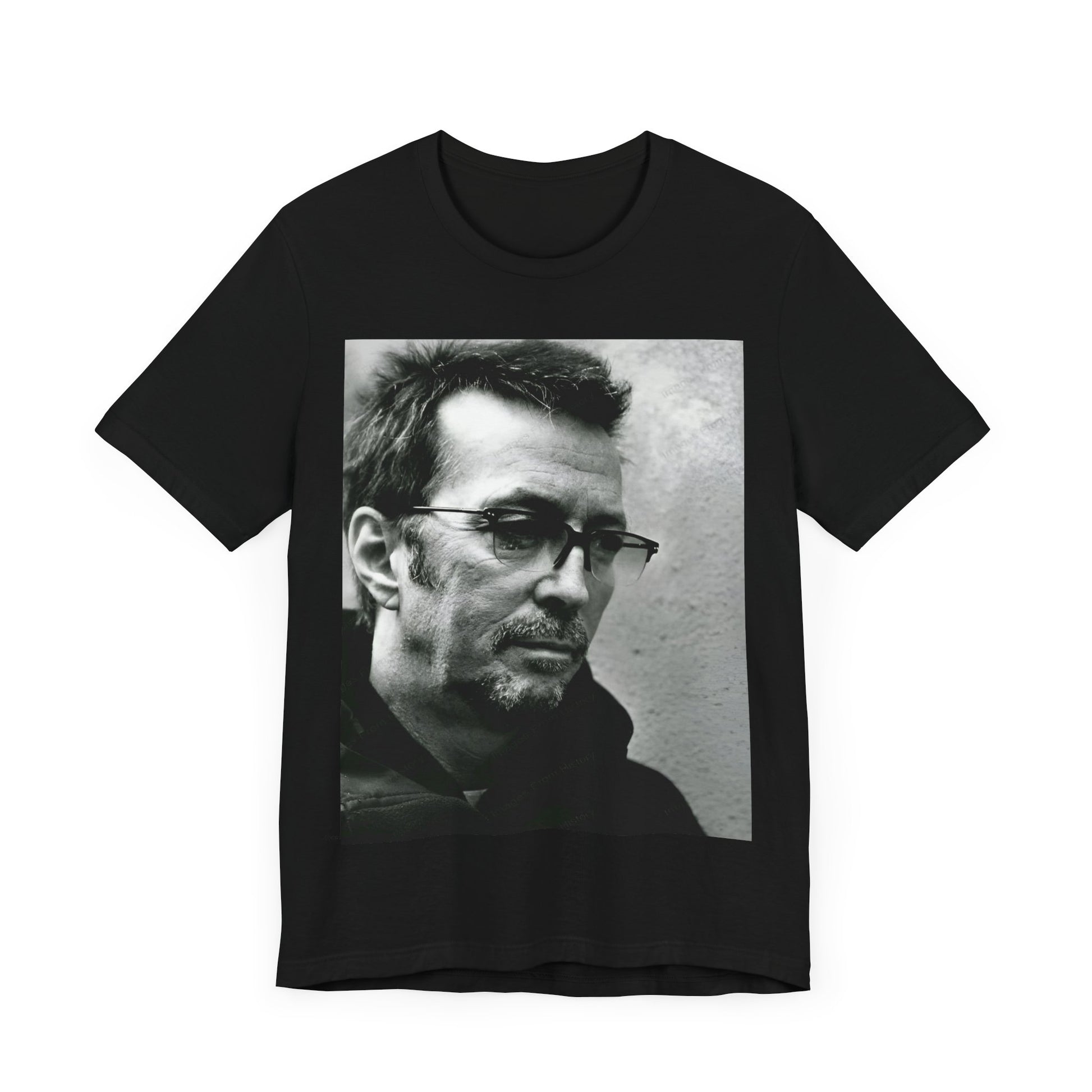 A black graphic t-shirt featuring a black and white, monochrome graphic or photo of Eric Clapton.