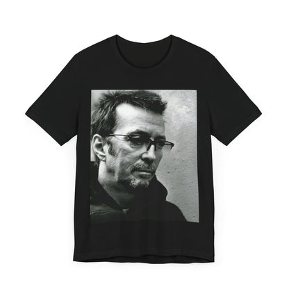 A black graphic t-shirt featuring a black and white, monochrome graphic or photo of Eric Clapton.