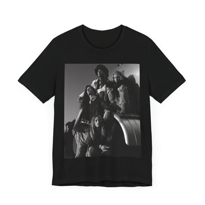 A black graphic t-shirt featuring a 90s black and white photographic portrait of the band Alice In Chains, capturing their iconic grunge look.