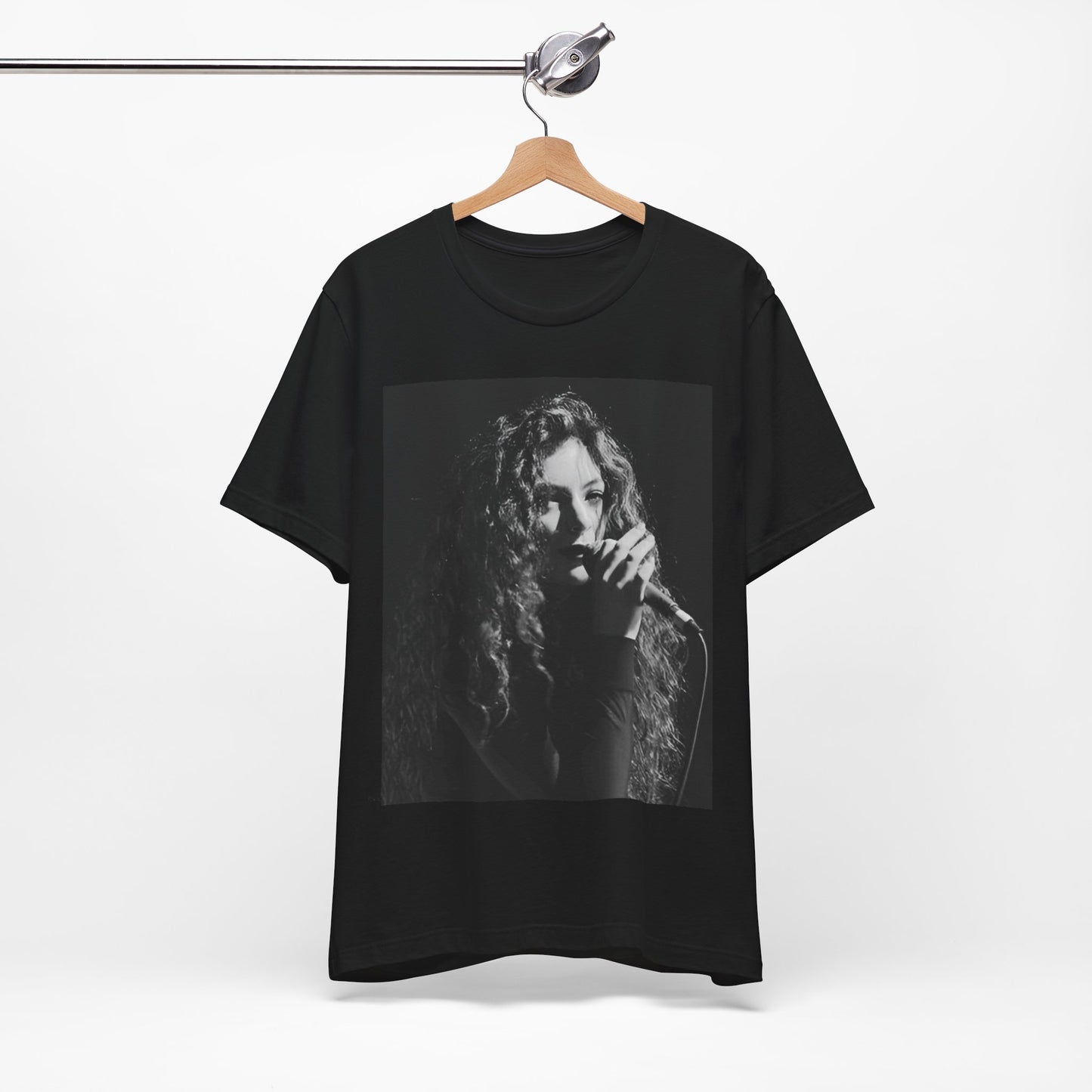 A black graphic t-shirt featuring a graphic or photo of Lorde performing live.
