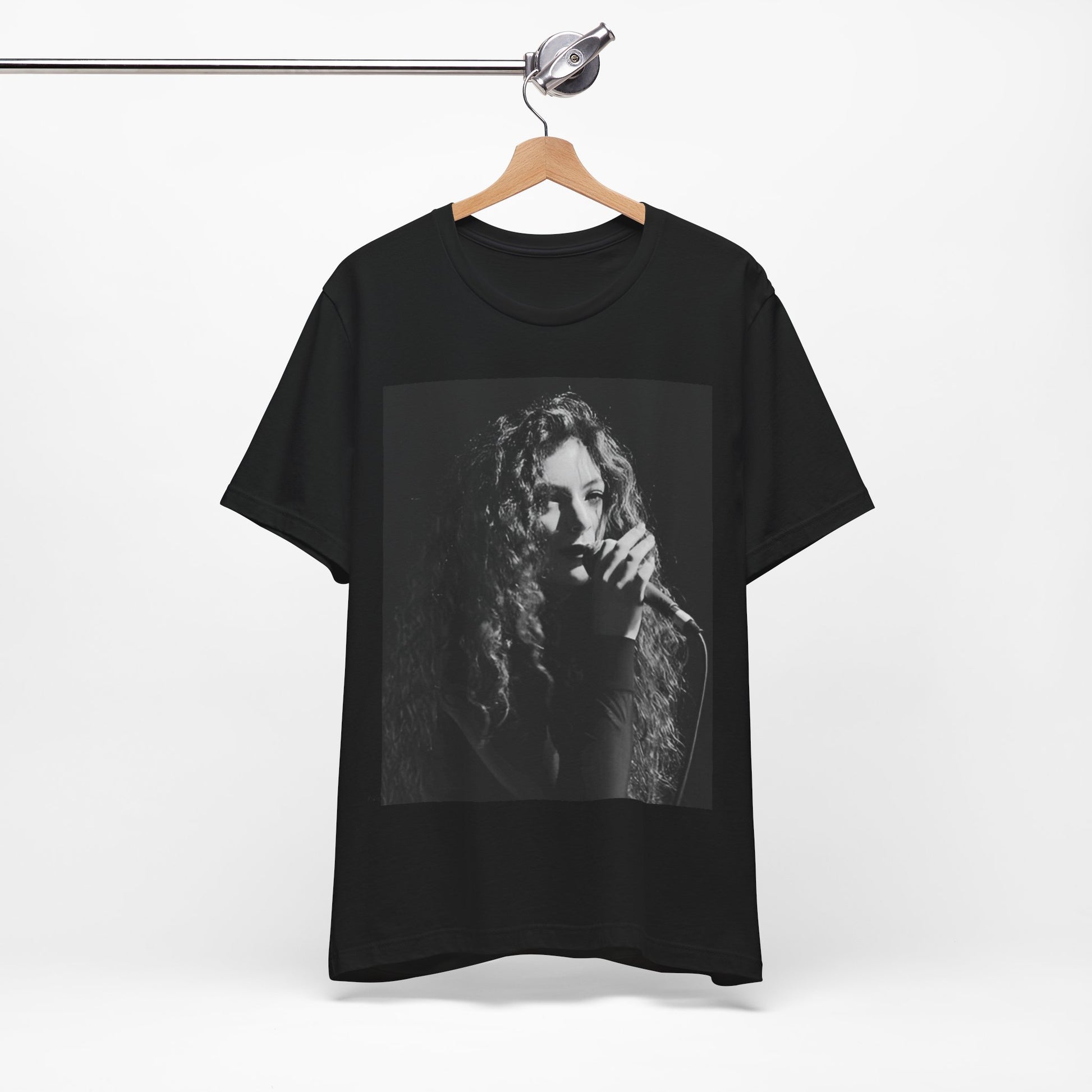 A black graphic t-shirt featuring a graphic or photo of Lorde performing live.