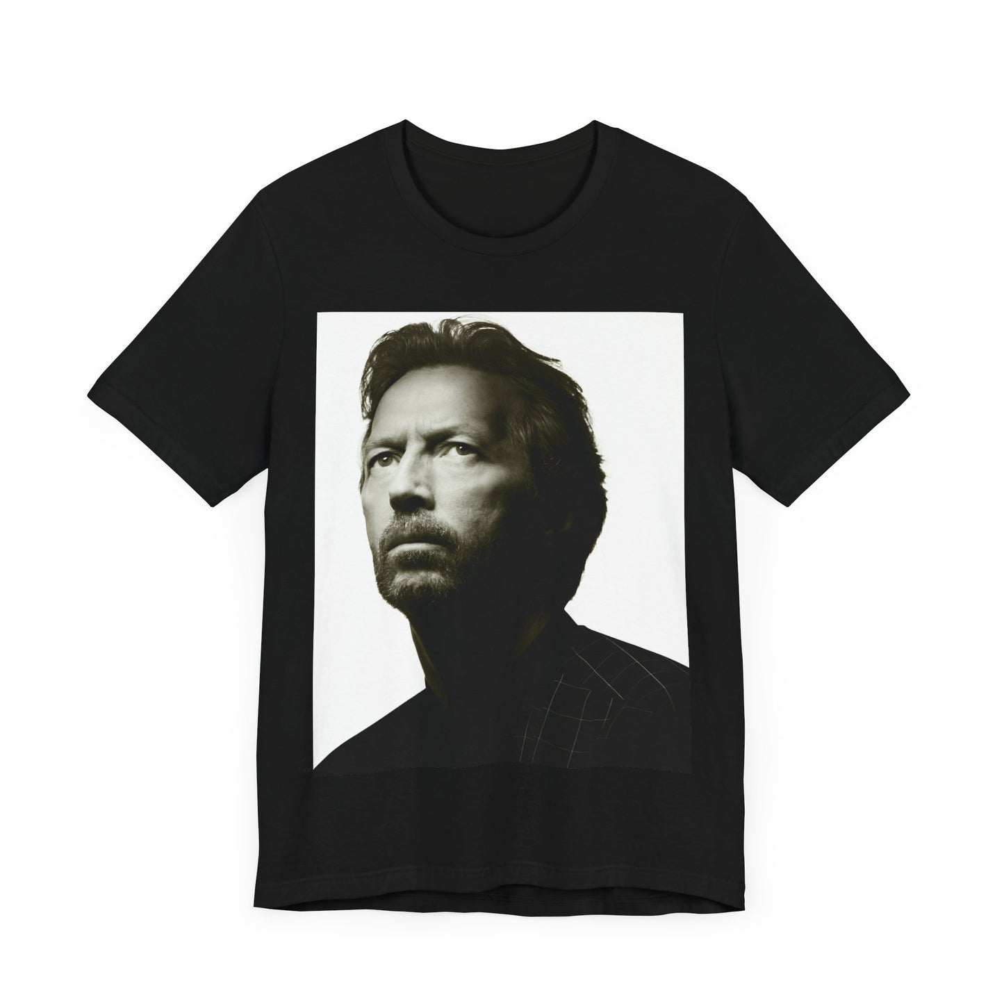A black graphic t-shirt featuring a retro black and white portrait photo of Eric Clapton.