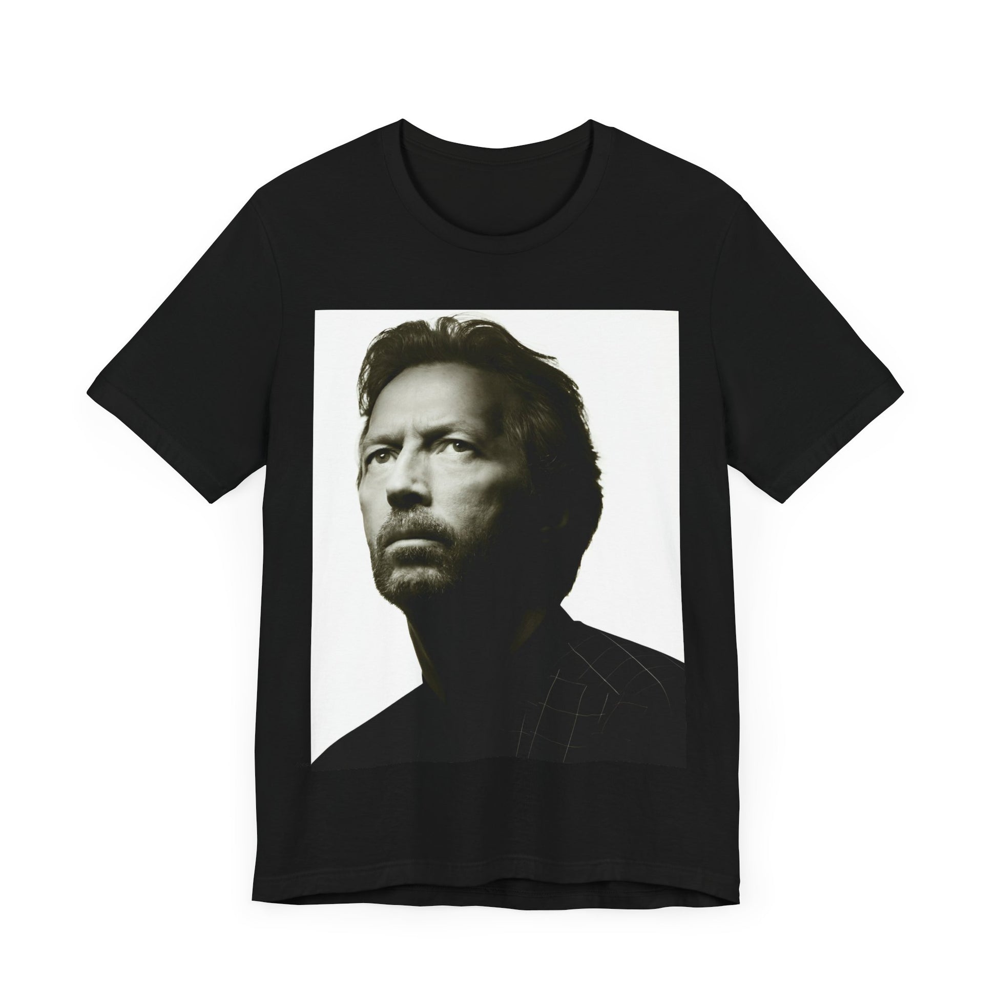 A black graphic t-shirt featuring a retro black and white portrait photo of Eric Clapton.