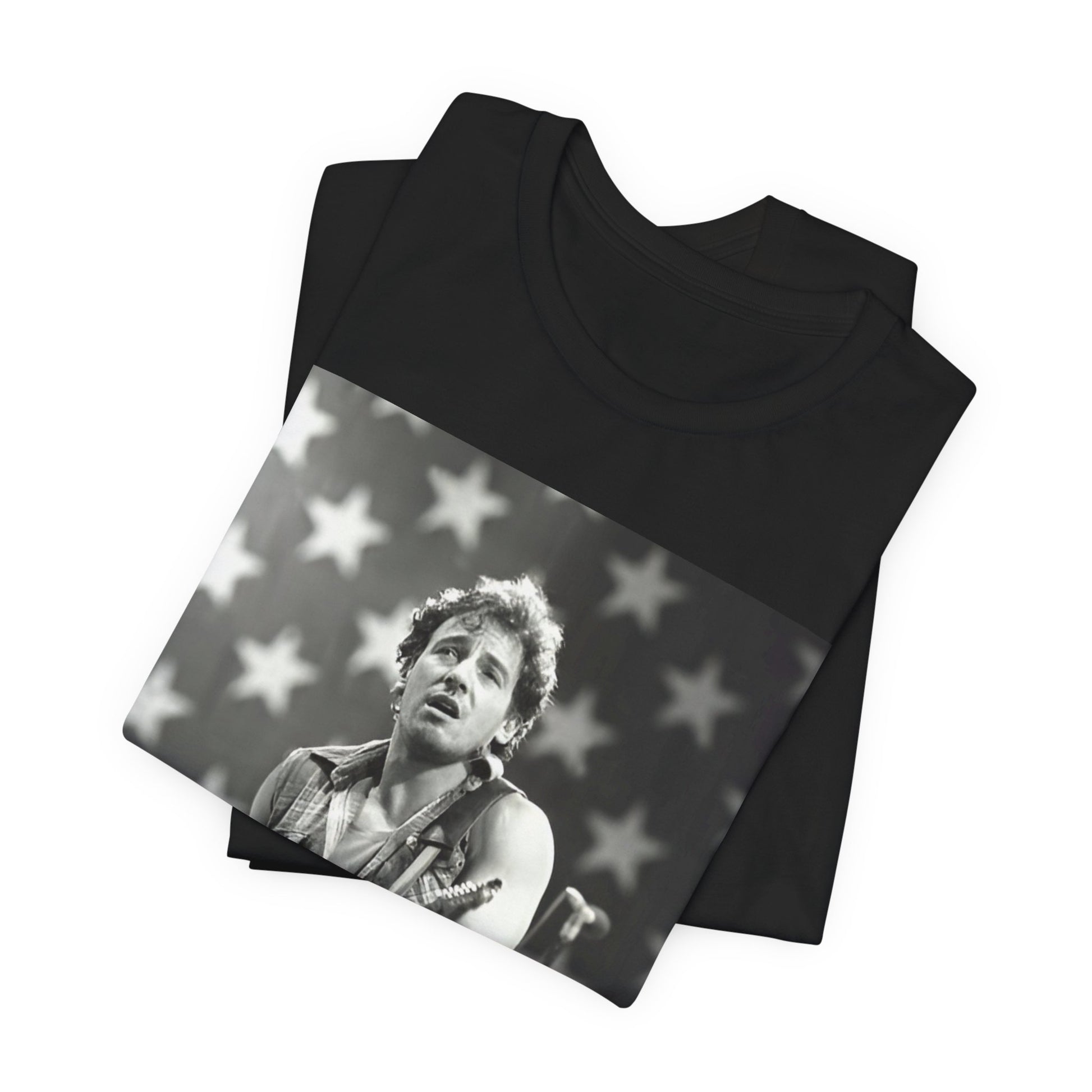 A black graphic t-shirt featuring a black and white graphic of Bruce Springsteen with an American flag background or elements.