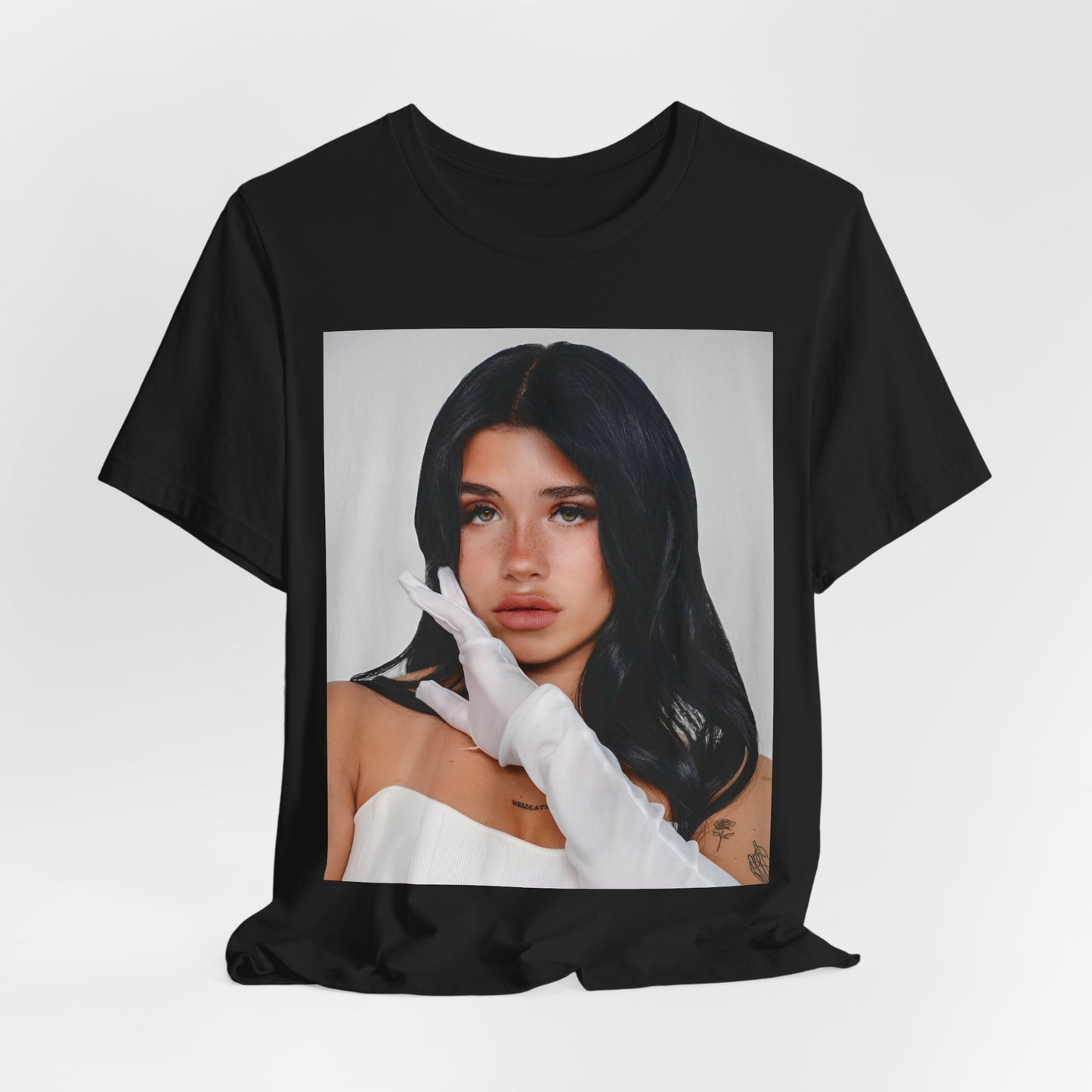 A black graphic t-shirt featuring a portrait graphic of Nessa Barrett.