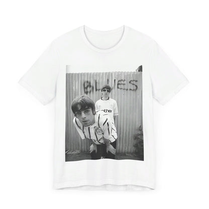 A black graphic t-shirt featuring a graphic of Liam and Noel Gallagher from Oasis, showing their support for Manchester City.
