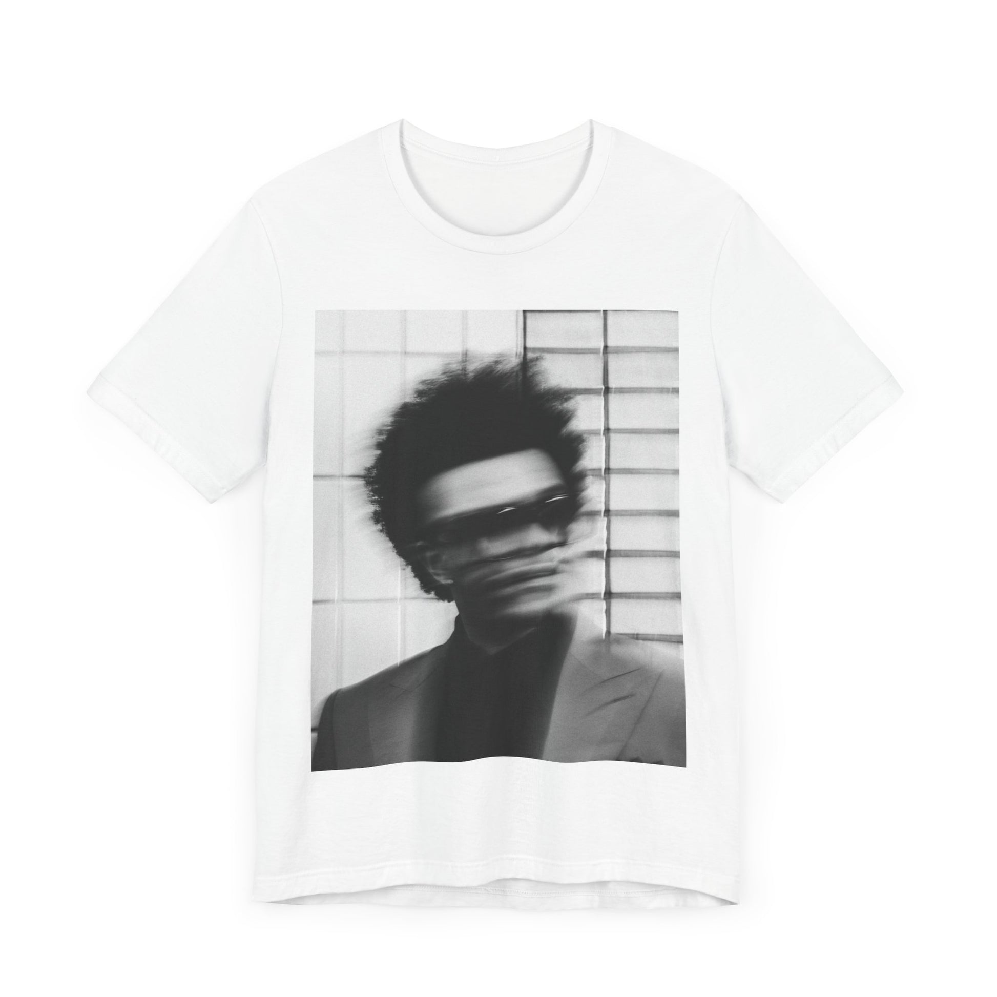A black graphic t-shirt featuring a blurred graphic of The Weeknd from his 'After Hours' era.