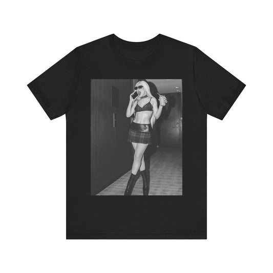 A black graphic t-shirt featuring a graphic of Ava Max with a 'rebel chic' or edgy pop aesthetic.
