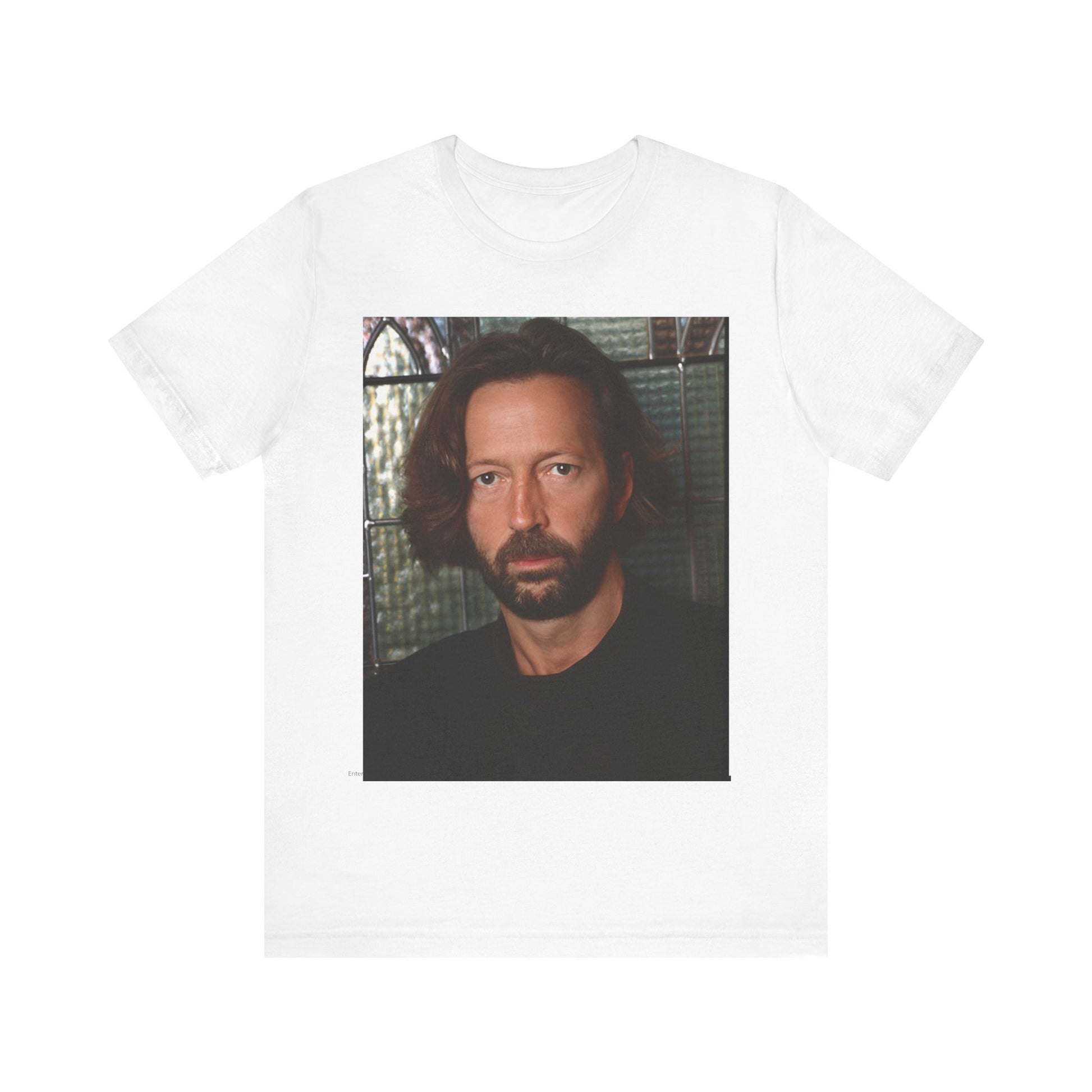 A black graphic t-shirt featuring a portrait graphic of Eric Clapton as a guitar god legend.