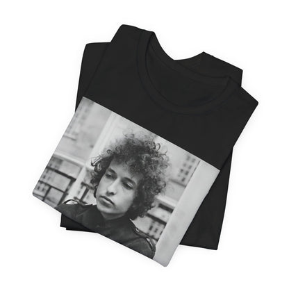 A black graphic t-shirt featuring a black and white graphic of Bob Dylan from the folk revival era.