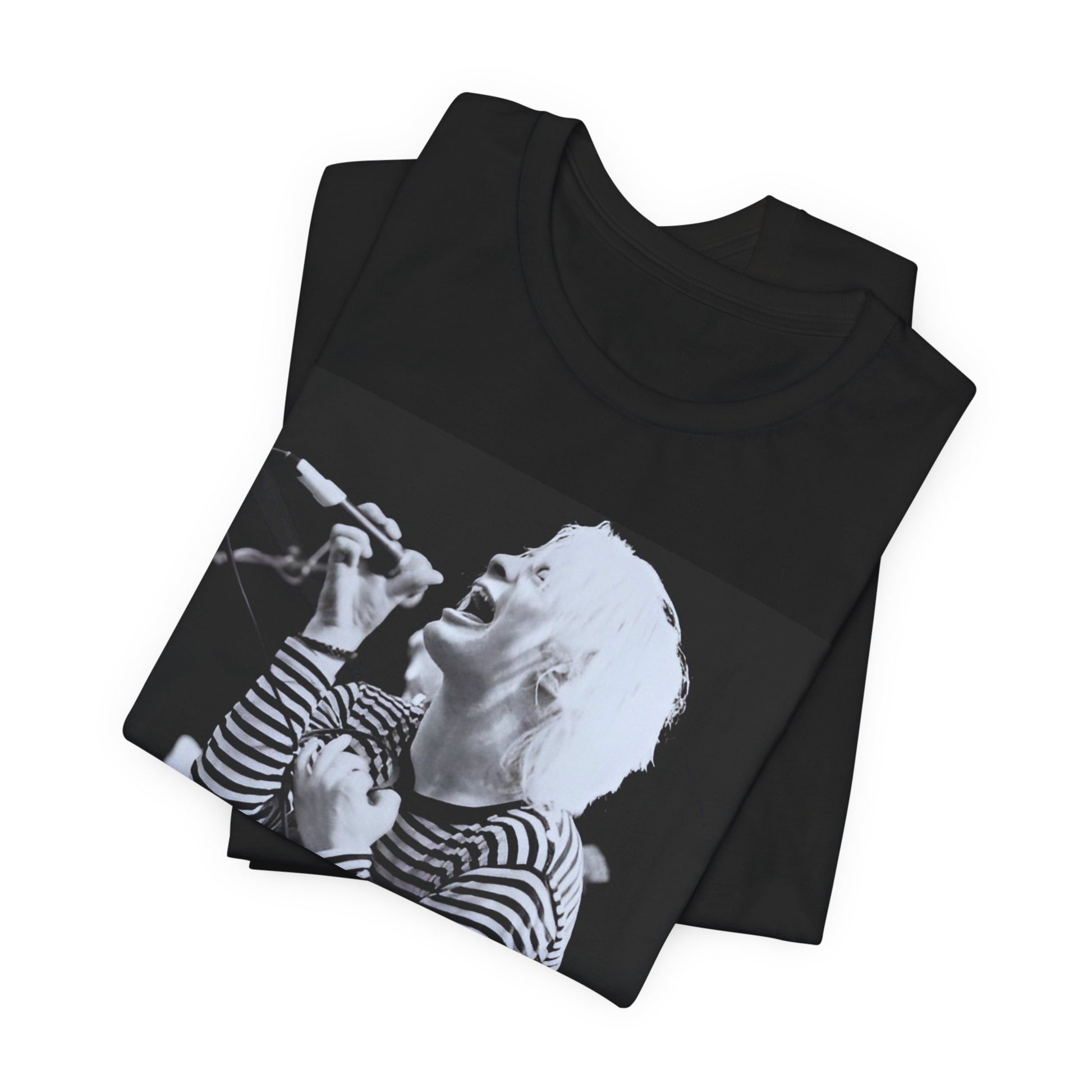 A black graphic t-shirt featuring a black and white graphic or photo of Radiohead performing live.