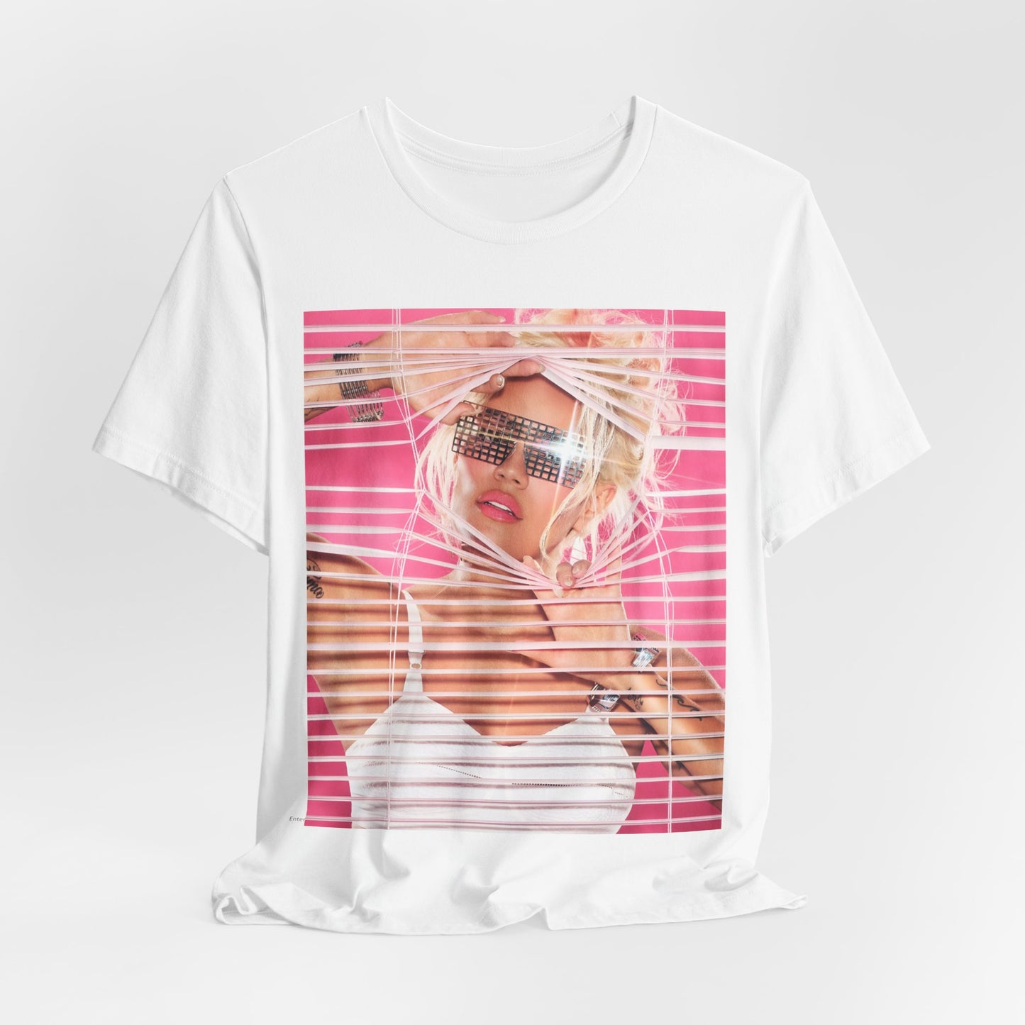 A black graphic t-shirt featuring a graphic of Karol G in a cool Latin trap style.