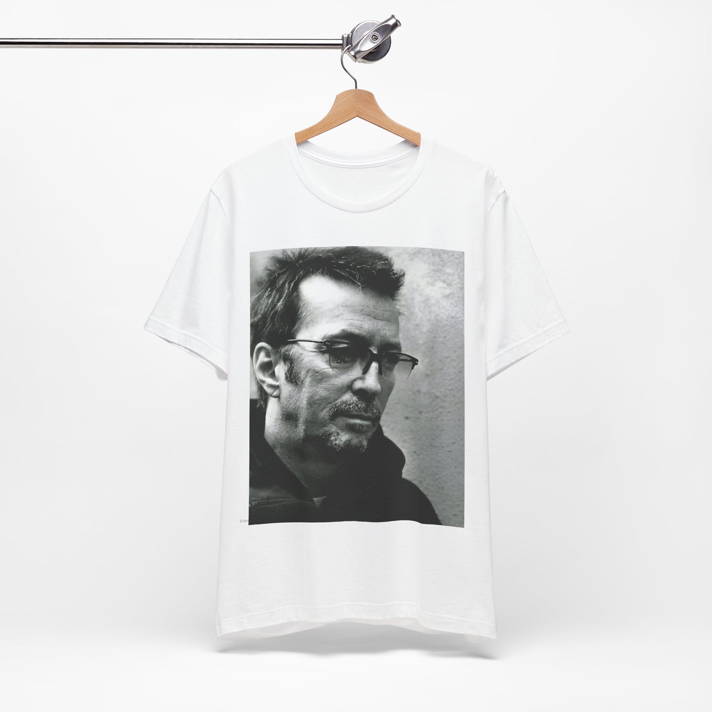 A black graphic t-shirt featuring a black and white, monochrome graphic or photo of Eric Clapton.
