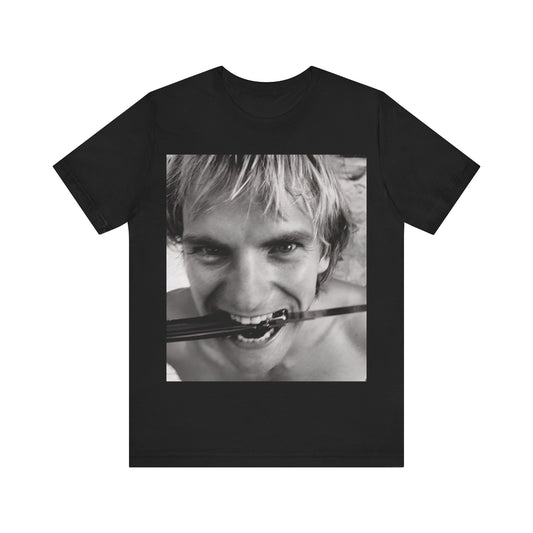 A black graphic t-shirt featuring a wild photo graphic of Sting.