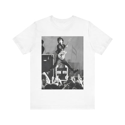 A black graphic t-shirt featuring a graphic of Billie Joe Armstrong from Green Day jumping on stage during a performance.